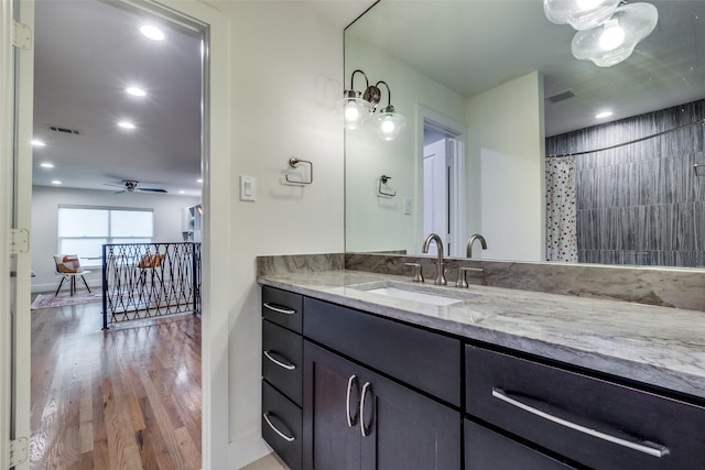 bathroom featuring a shower with curtain, ceiling fan, vanity, and hardwood / wood-style floors