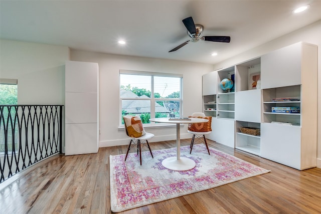 office space with ceiling fan and light wood-type flooring