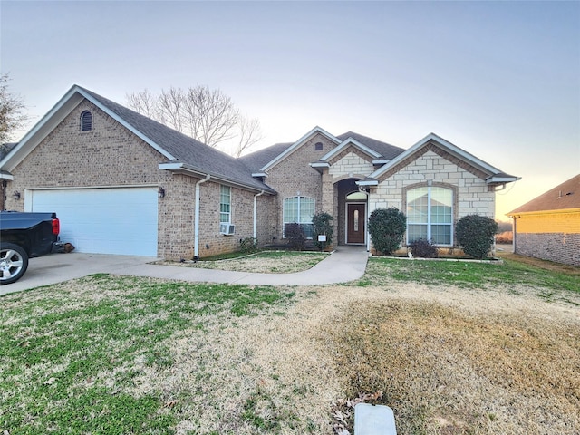 single story home with cooling unit, a garage, and a lawn