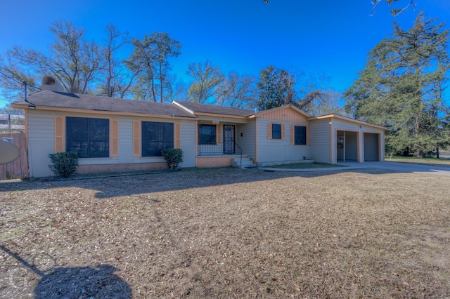 ranch-style home featuring a garage