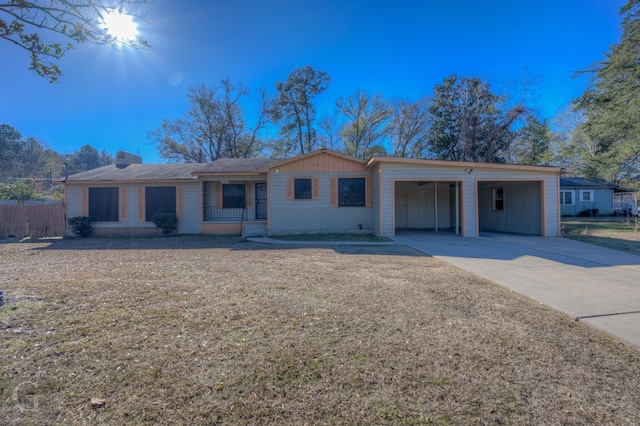 ranch-style home featuring a carport