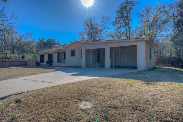 ranch-style house with a carport and a front yard