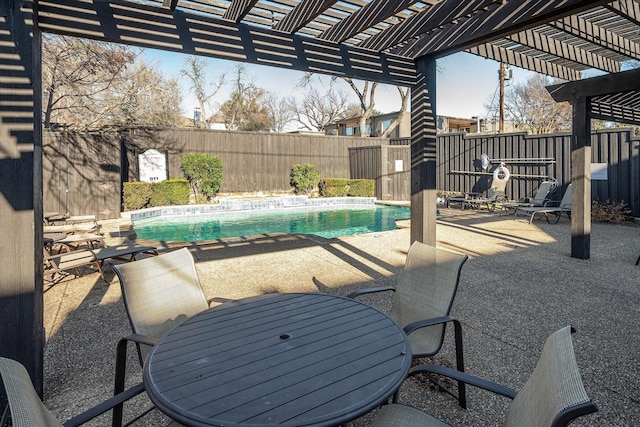 view of patio featuring a fenced in pool and a pergola