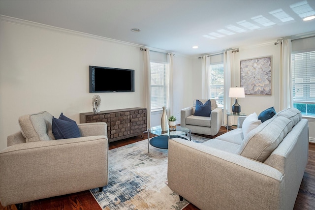 living room featuring ornamental molding and dark wood-type flooring