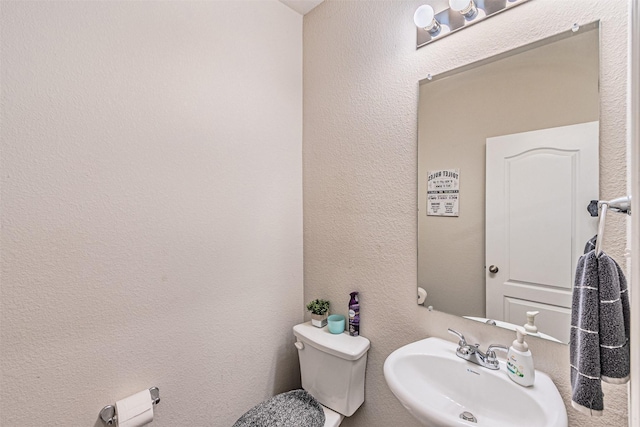 bathroom with sink and toilet