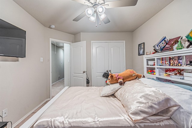 bedroom with ceiling fan and a closet