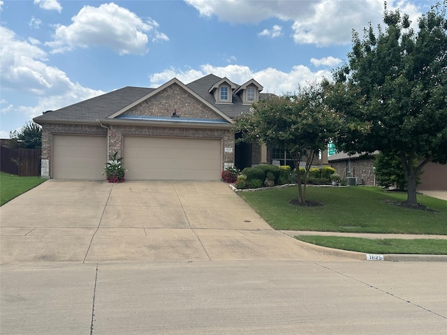 craftsman-style home with a garage and a front lawn