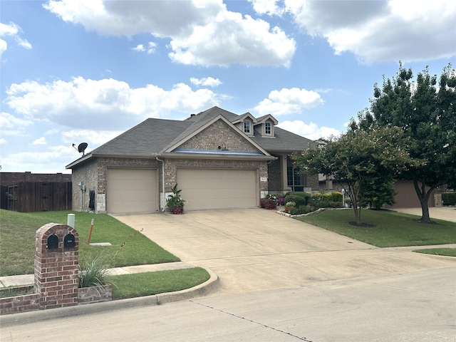 view of front facade featuring a garage and a front lawn