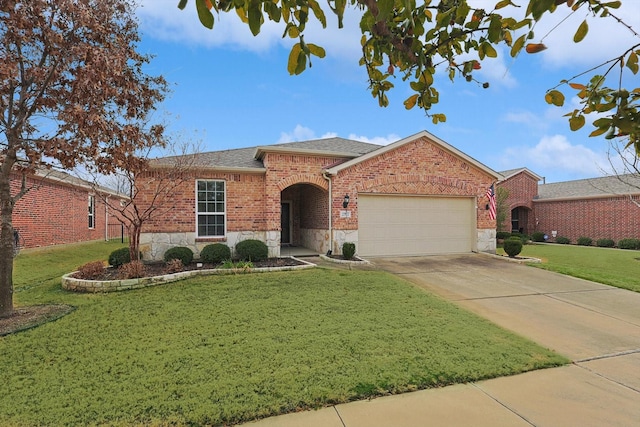 single story home featuring a garage and a front lawn