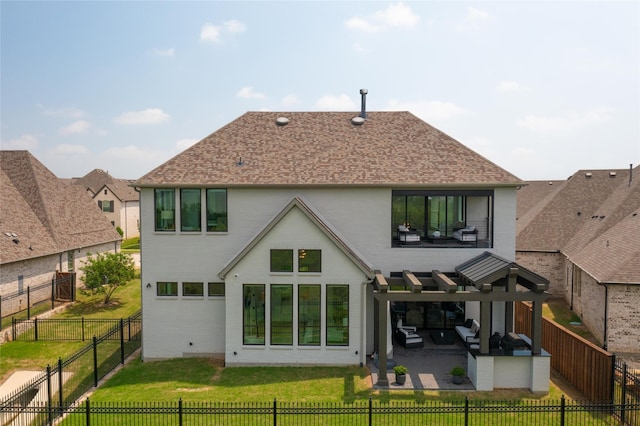 back of house featuring a yard and a patio area