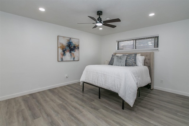 bedroom featuring hardwood / wood-style flooring and ceiling fan