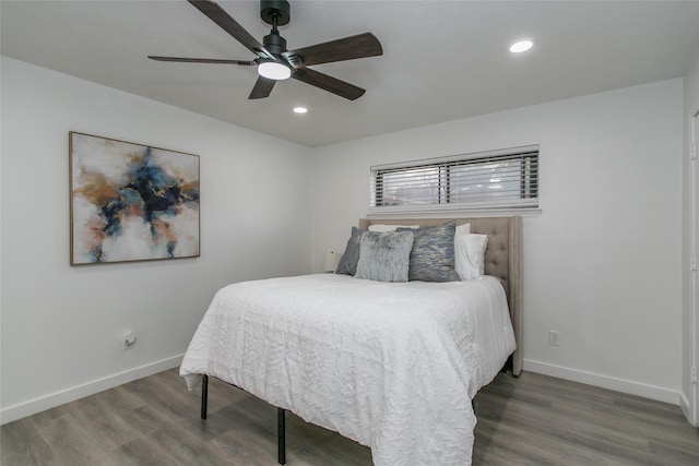 bedroom with hardwood / wood-style flooring and ceiling fan