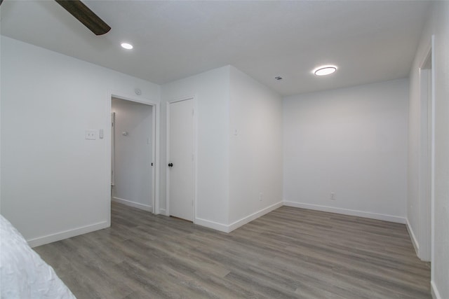 unfurnished room featuring hardwood / wood-style floors and ceiling fan