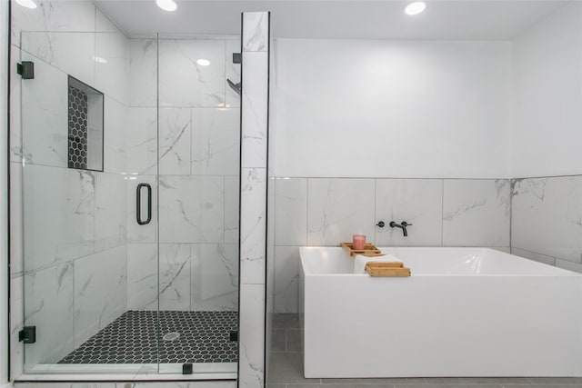 bathroom featuring plus walk in shower