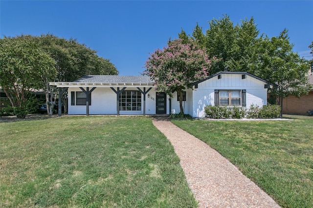 ranch-style house with a front lawn