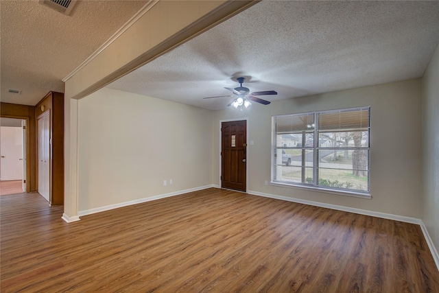 interior space with hardwood / wood-style flooring, a textured ceiling, and ceiling fan