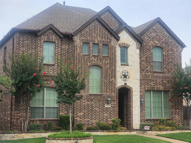 5056 Empire Way, Irving, TX 75038 - french provincial home with brick siding, a shingled roof, and stone siding