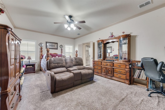 bedroom with carpet floors, ornamental molding, and ceiling fan