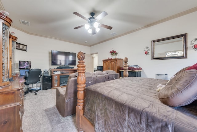 bedroom with ornamental molding, carpet, and ceiling fan