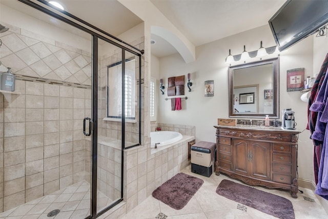 bathroom with plus walk in shower, vanity, and tile patterned floors