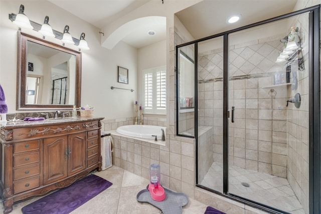 bathroom featuring vanity, separate shower and tub, and tile patterned flooring