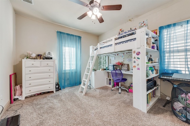 carpeted bedroom with ceiling fan