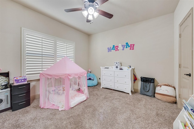 game room with light carpet and ceiling fan