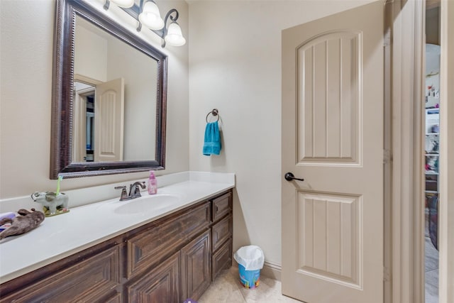 bathroom featuring tile patterned flooring and vanity