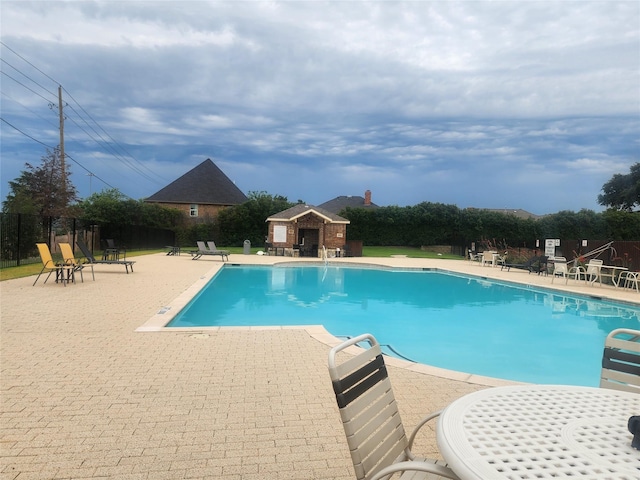 5056 Empire Way, Irving, TX 75038 - community pool featuring a patio and an outdoor structure