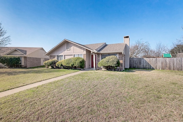 single story home with a front lawn