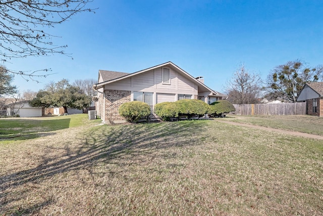 view of side of property featuring a yard