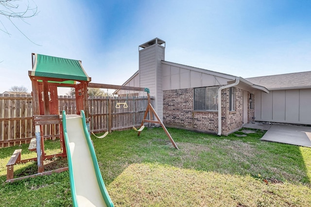 view of play area featuring a lawn