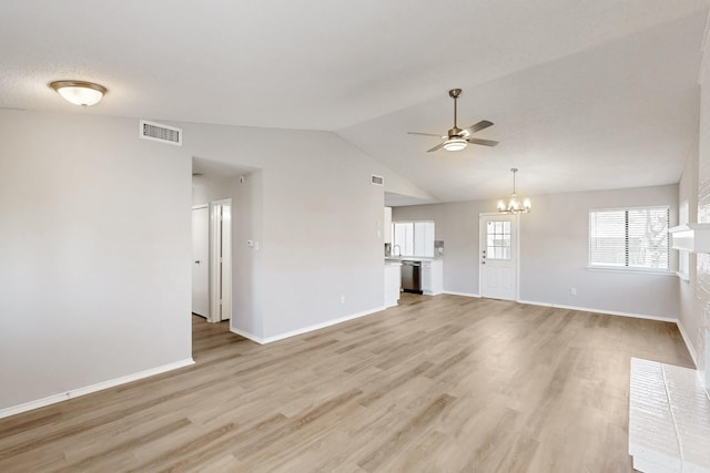 unfurnished living room with ceiling fan with notable chandelier, lofted ceiling, and light hardwood / wood-style floors