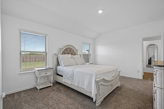 carpeted bedroom with vaulted ceiling