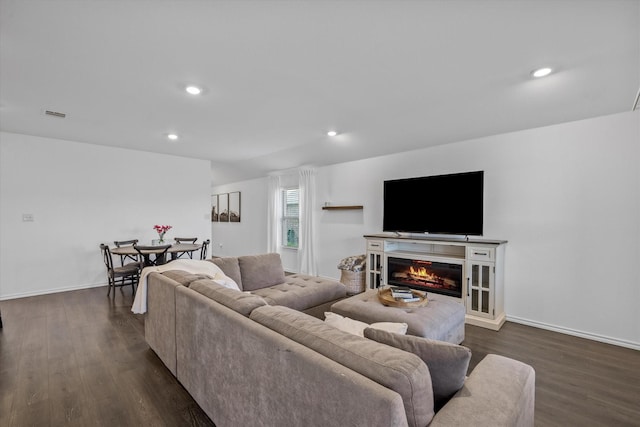 living room featuring dark hardwood / wood-style floors