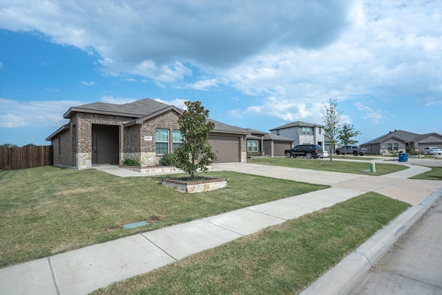 view of front facade with a garage and a front lawn