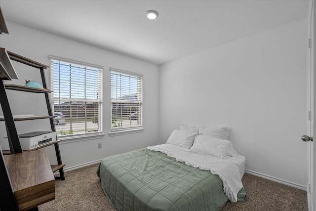 bedroom with dark carpet