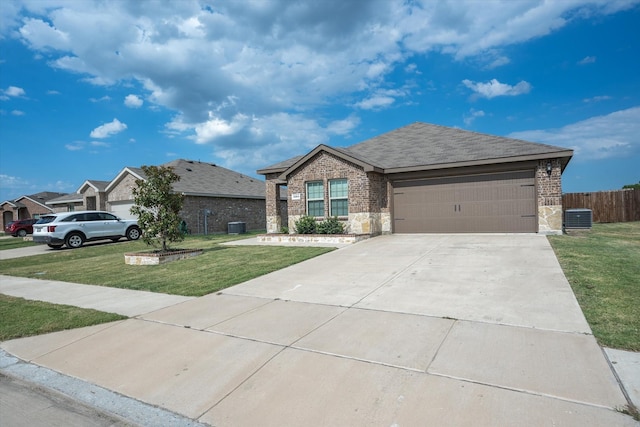 ranch-style house with central AC, a garage, and a front lawn