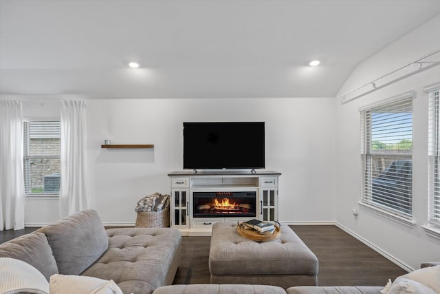 living room with lofted ceiling and dark wood-type flooring