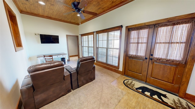 living room with crown molding, ceiling fan, and wood ceiling