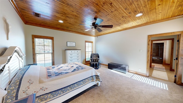 bedroom featuring crown molding, wood ceiling, ceiling fan, and carpet flooring