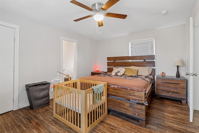 bedroom with ceiling fan and dark hardwood / wood-style flooring