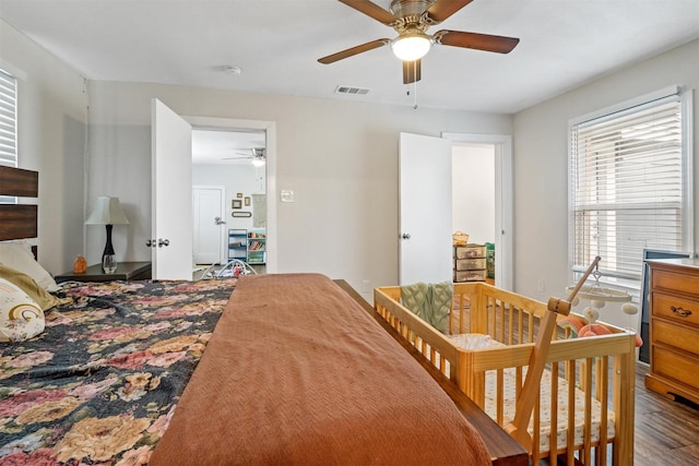 bedroom featuring hardwood / wood-style floors and ceiling fan