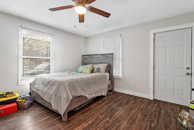 bedroom with ceiling fan and dark hardwood / wood-style flooring