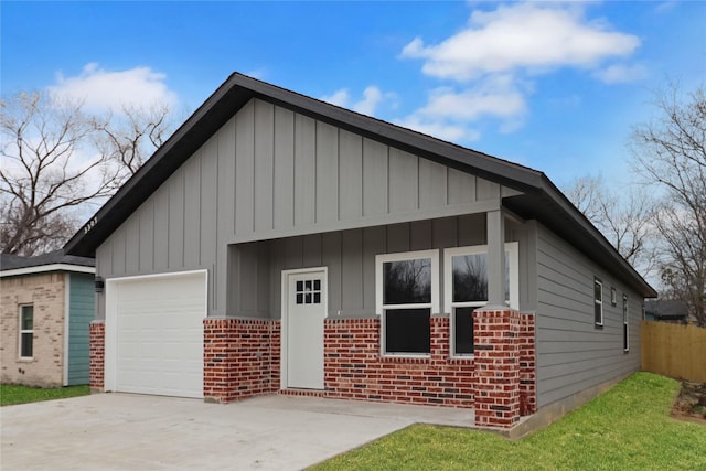 3307 Langford St, Greenville, TX 75401 - view of front of property featuring concrete driveway, fence, board and batten siding, brick siding, and a garage