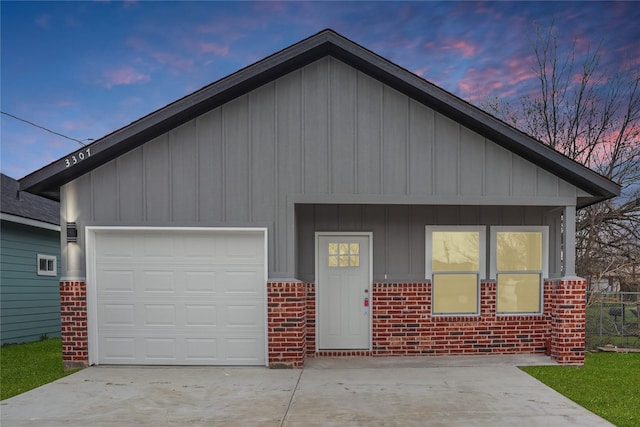 3307 Langford St, Greenville, TX 75401 - view of front of home with brick siding, concrete driveway, and a garage