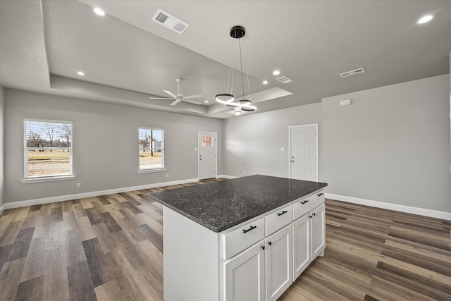 3307 Langford St, Greenville, TX 75401 - kitchen featuring open floor plan, visible vents, baseboards, and a raised ceiling