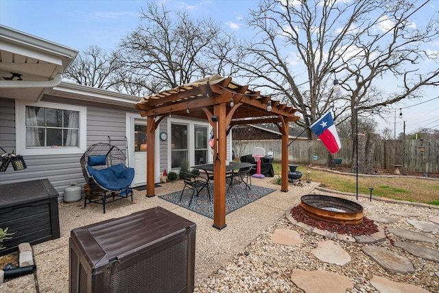 view of patio featuring a pergola and an outdoor fire pit