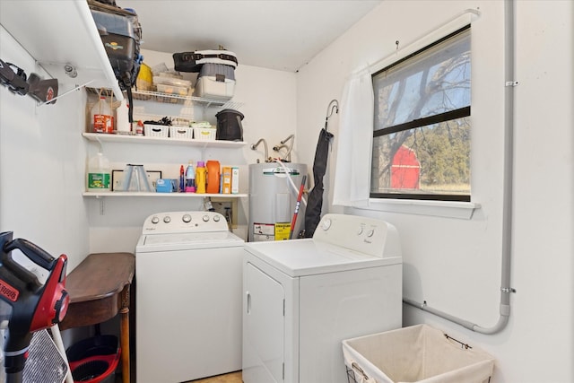 washroom featuring water heater, sink, and washing machine and clothes dryer