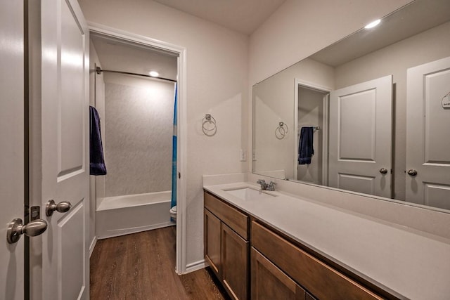 full bathroom featuring vanity, shower / bathing tub combination, hardwood / wood-style flooring, and toilet